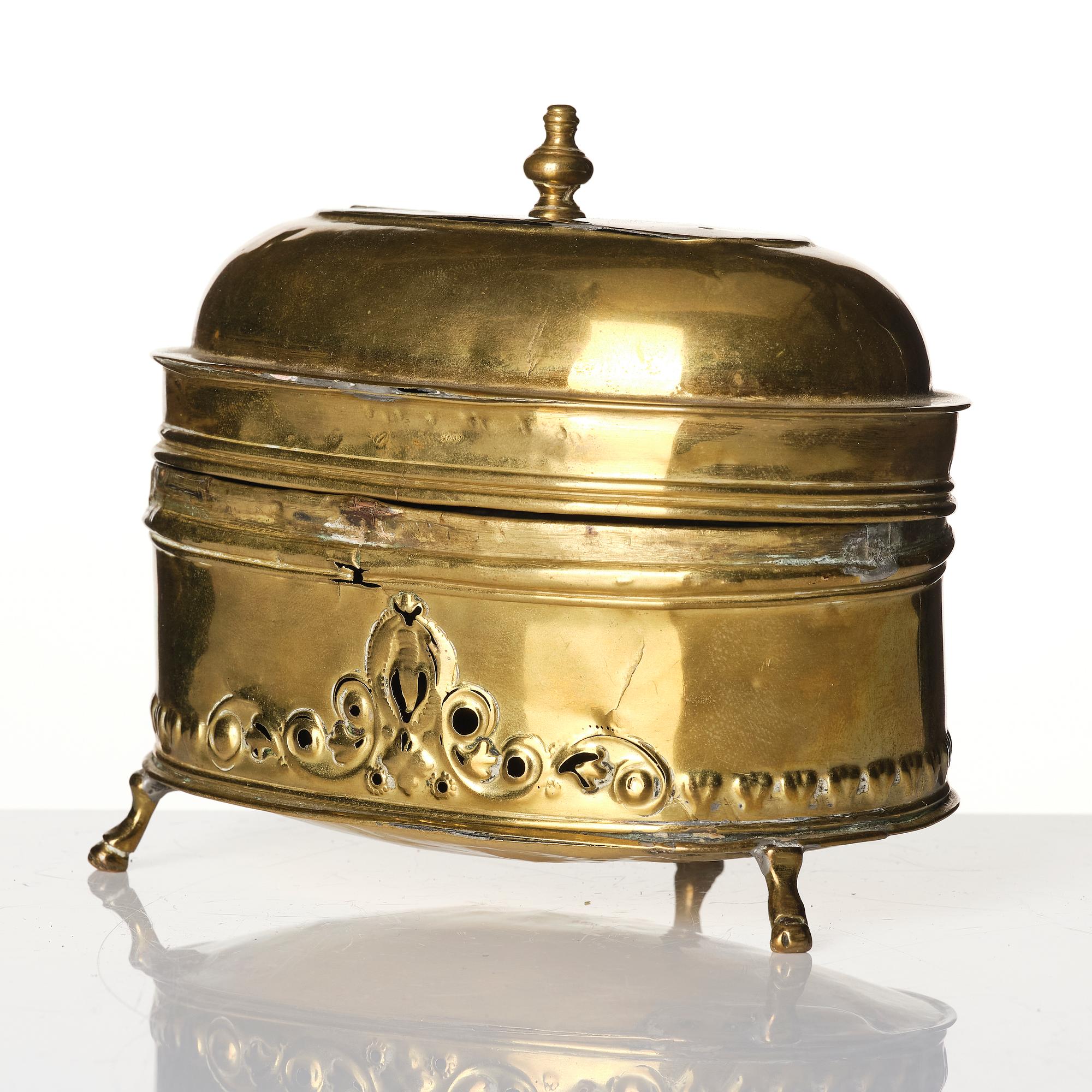 A baroque repousse brass pyxis, 18th century.