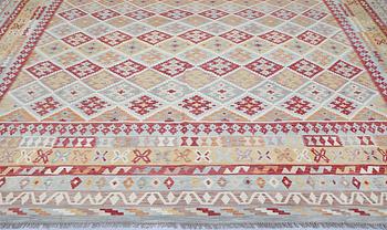 A Kilim carpet, approx. 591 x 401 cm.