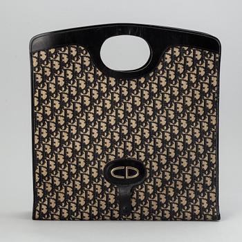 Christian Dior, Oblique fold-over convertible clutch.