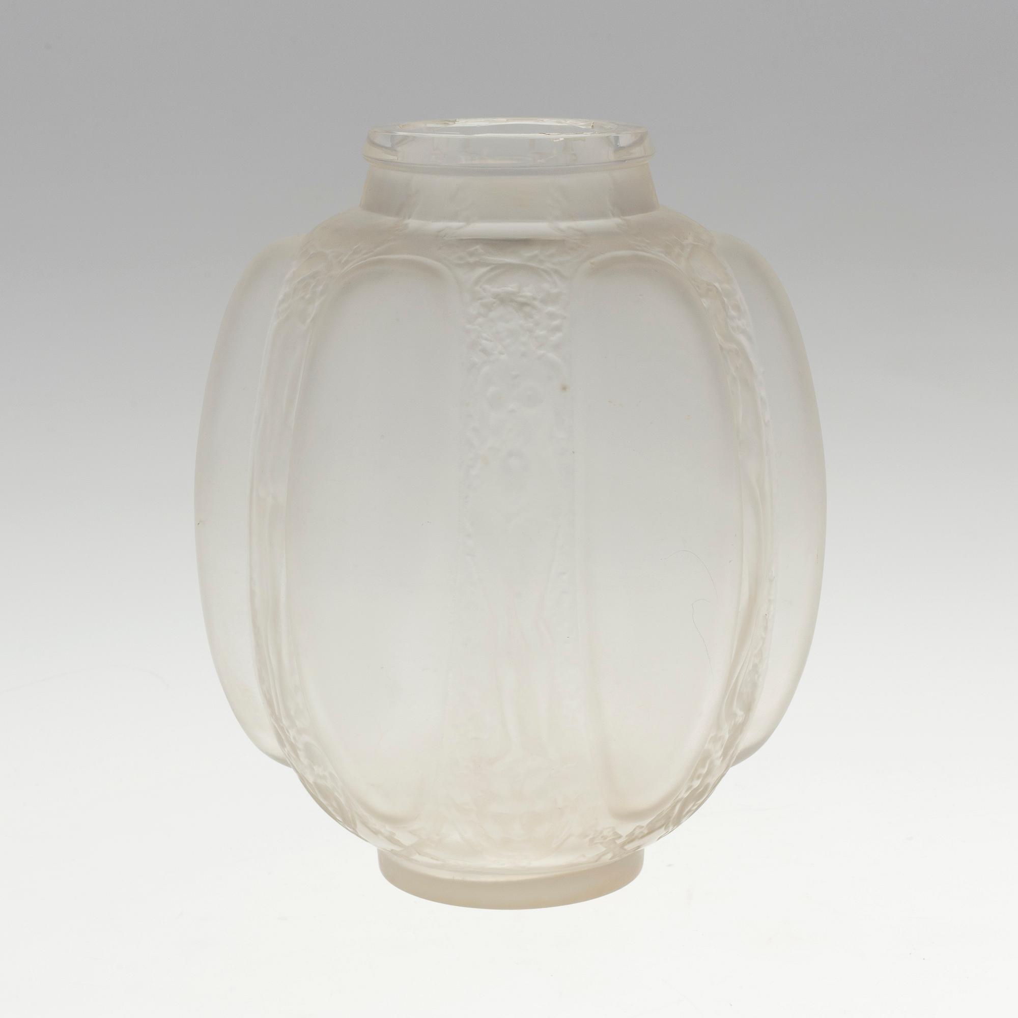 A René Lalique 'Six figurines et masques' moulded glass vase, France 1920-30's.