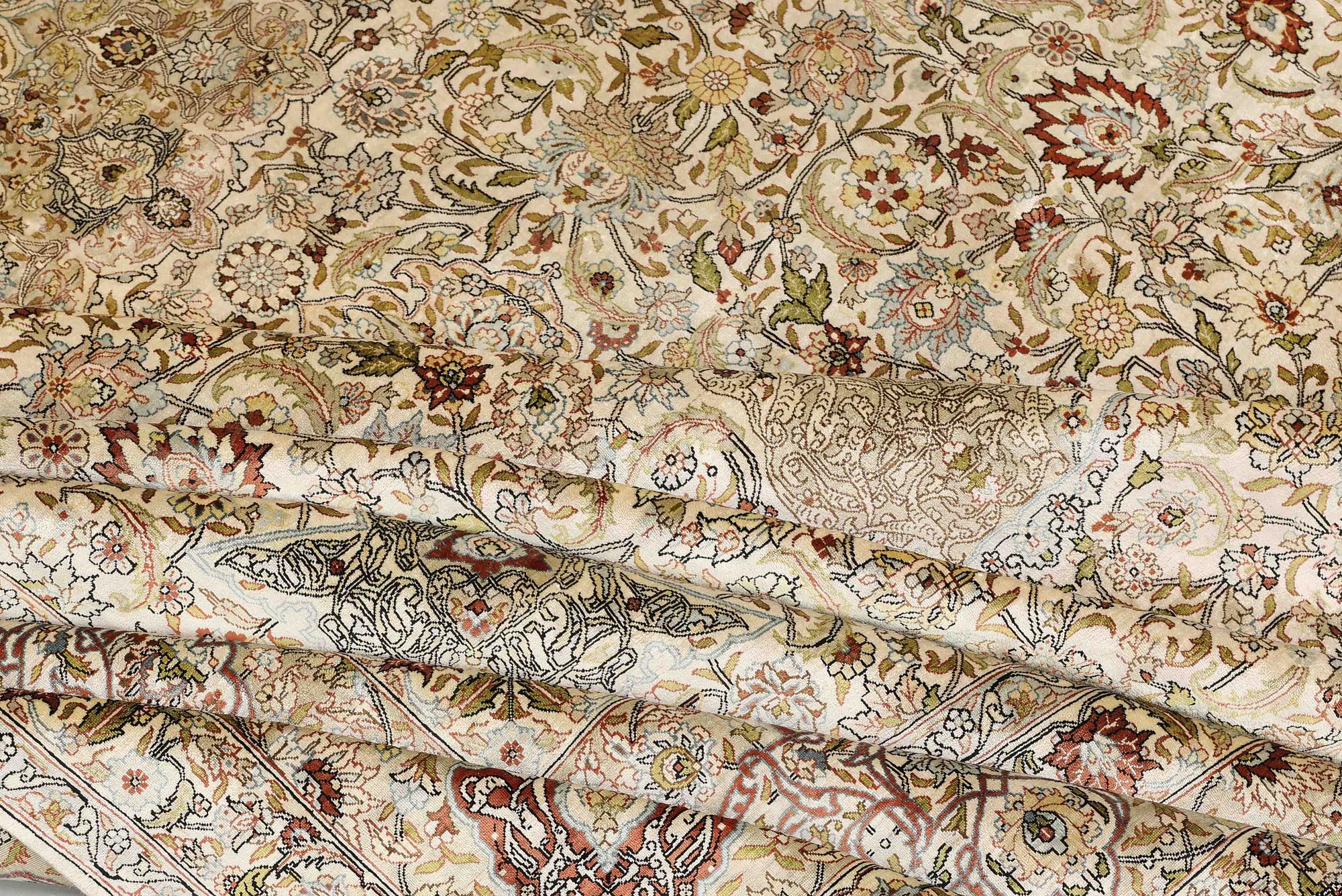 A oriental silk carpet, 350 x 247 cm.