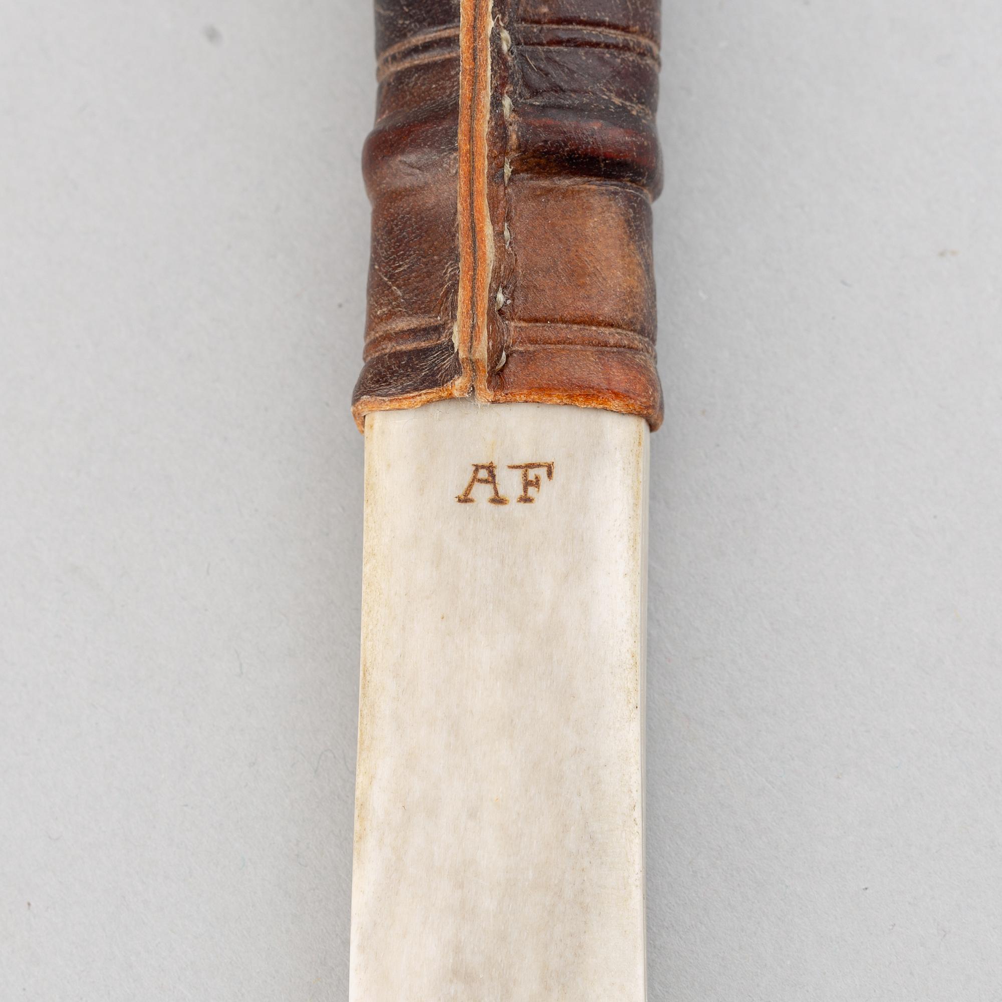 Anders Fankki, a Sami reindeer horn knife, signed AF.