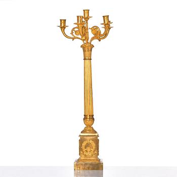 A French late Empire gilded six-light candelabra, mid 19th century.