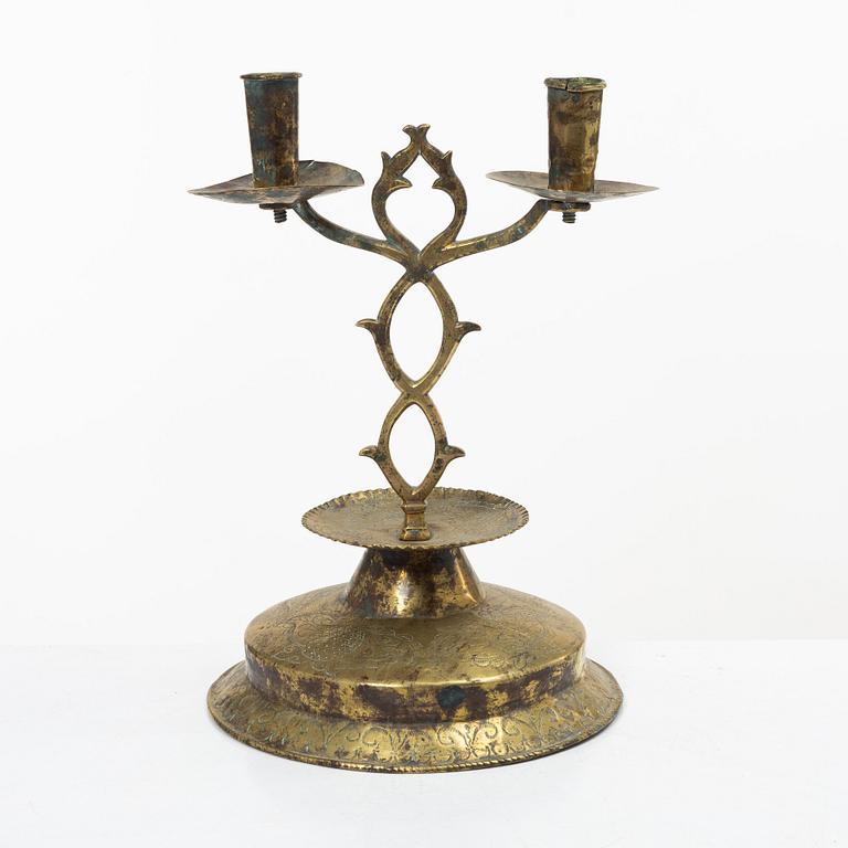 A Swedish brass two-branch candlestick, 18th/first part 19th century.