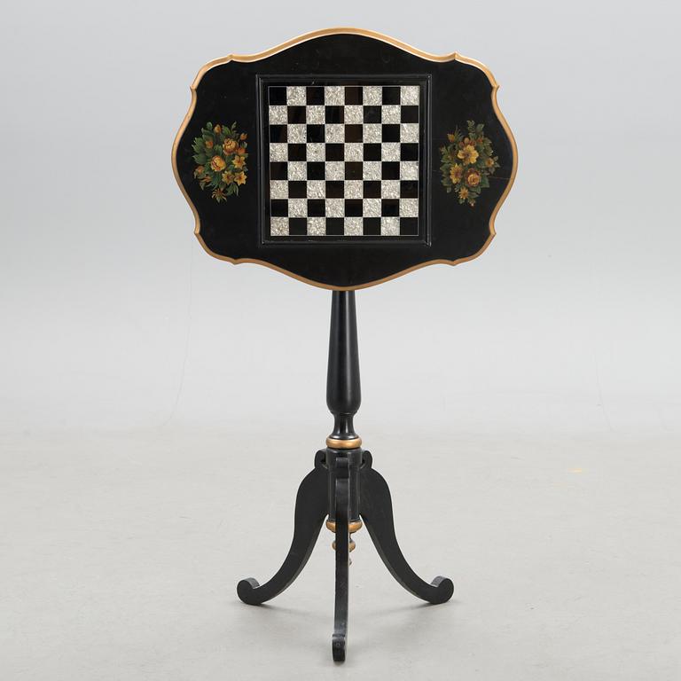A Chinese tilt top chess table from the first half of the 20th century.