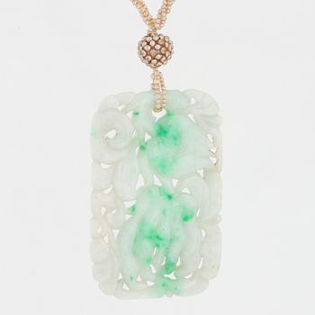 A most likely jade pendant with pearls.