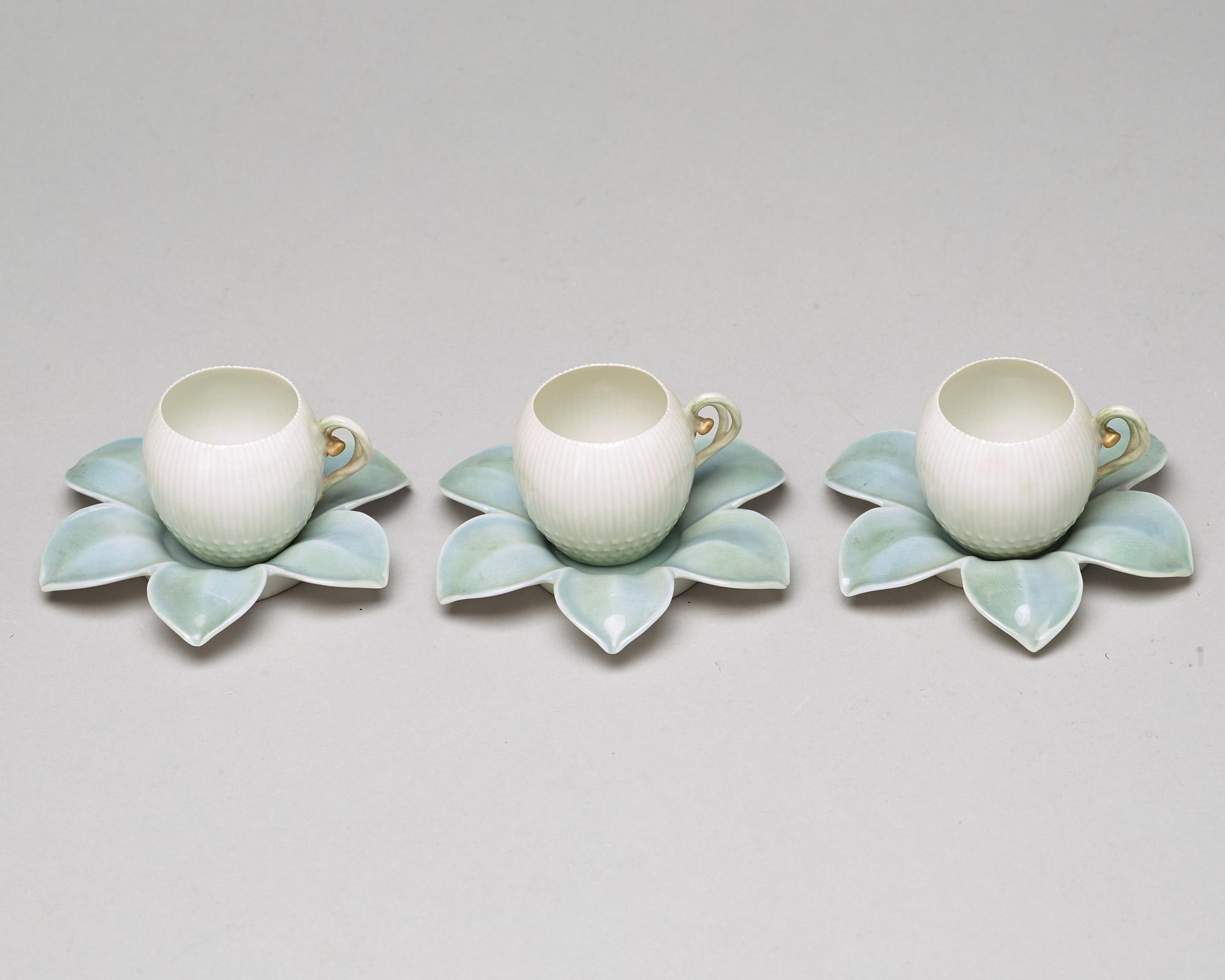 A set of six (3+3) cups with stands, Denmark, Bing & Gröndahl, early 20th Century.