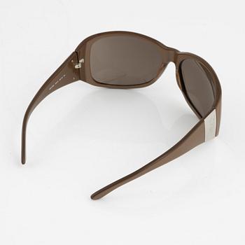 Dolce & Gabbana, a pair of beige sunglasses, 2007.