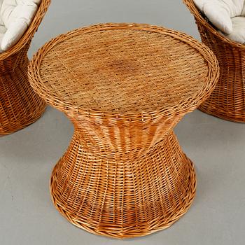 A pair of chairs and one table from the latter half of the 20th century.