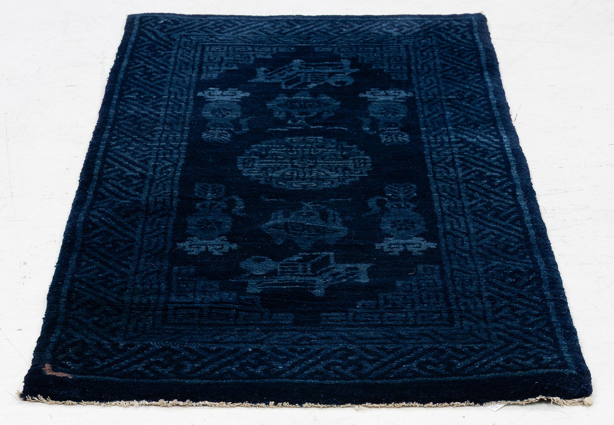 An antique Baotou, rug north China, c. 140 x 70 cm.