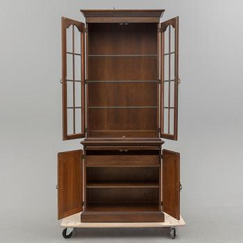 A second half of the 20th century vitrine cabinet marked "Pennsylvania House".
