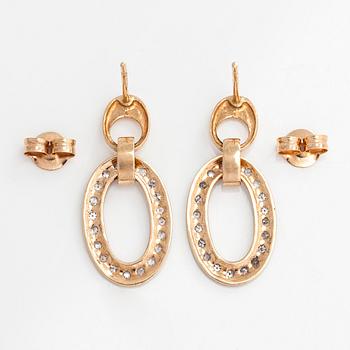 A pair of 14K gold earrings, with diamonds totalling approx. Finnish hallmarks.