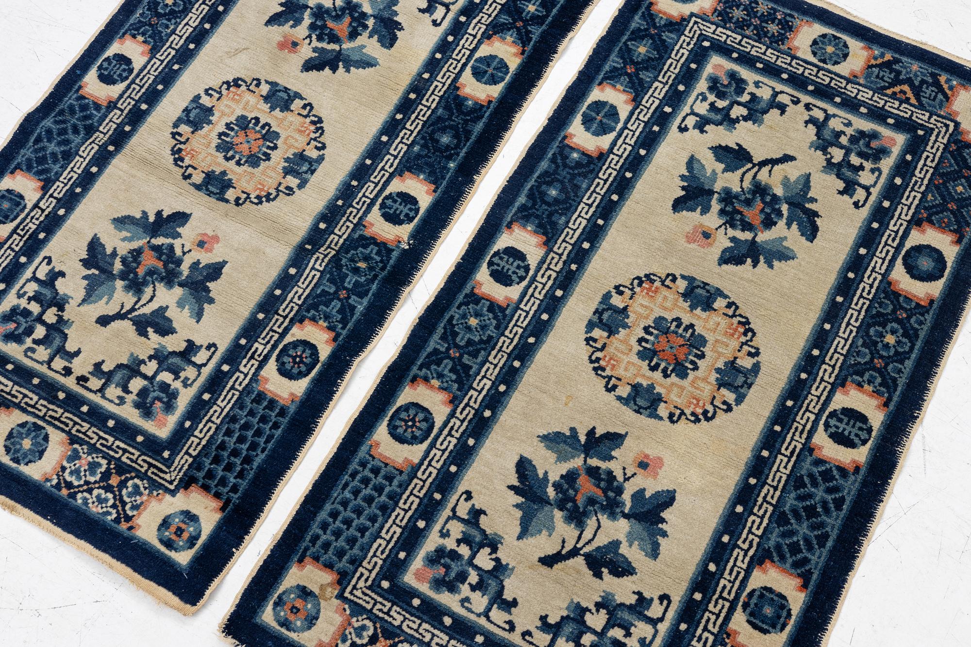 A pair of Baotou rugs, China, c. 120 x 64 cm.