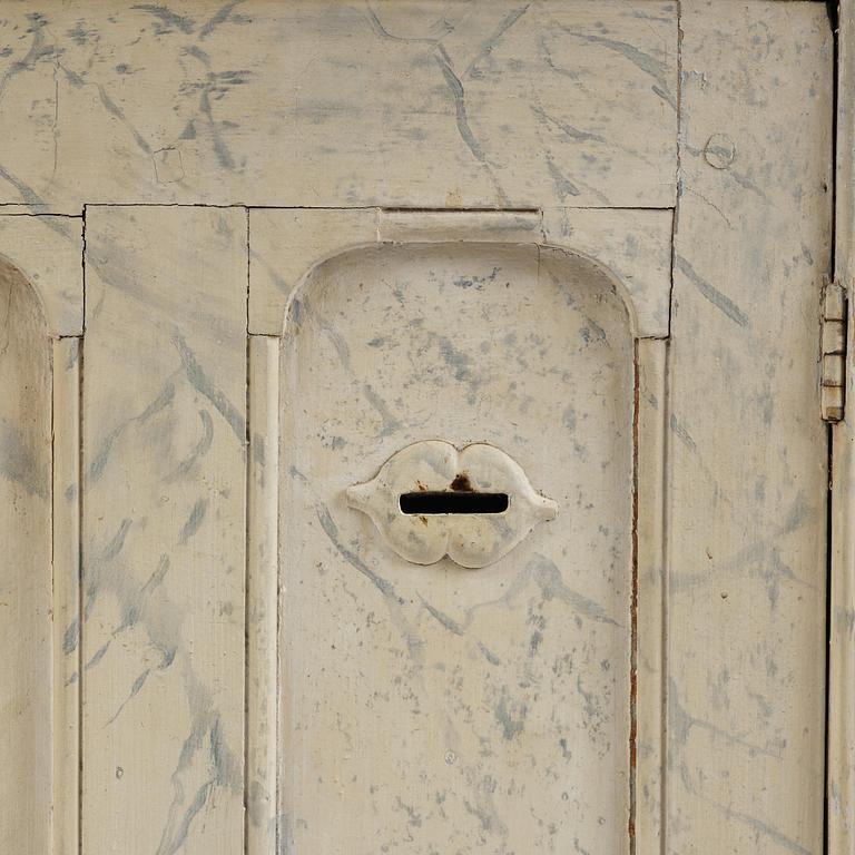 A Swedish column-shaped cabinet 19 th century.