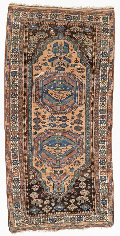 Rug, likely Kurdish, circa 1900, approximately 314 x 156 cm.
