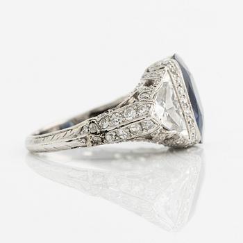 A platinum ring set with a faceted sapphire.