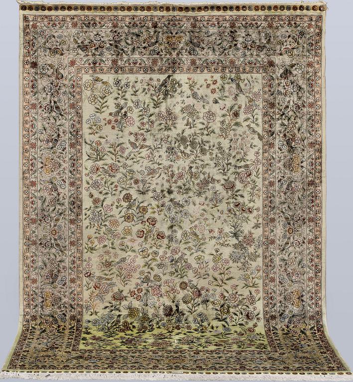 A oriental silk rug, 183 x 129 cm.