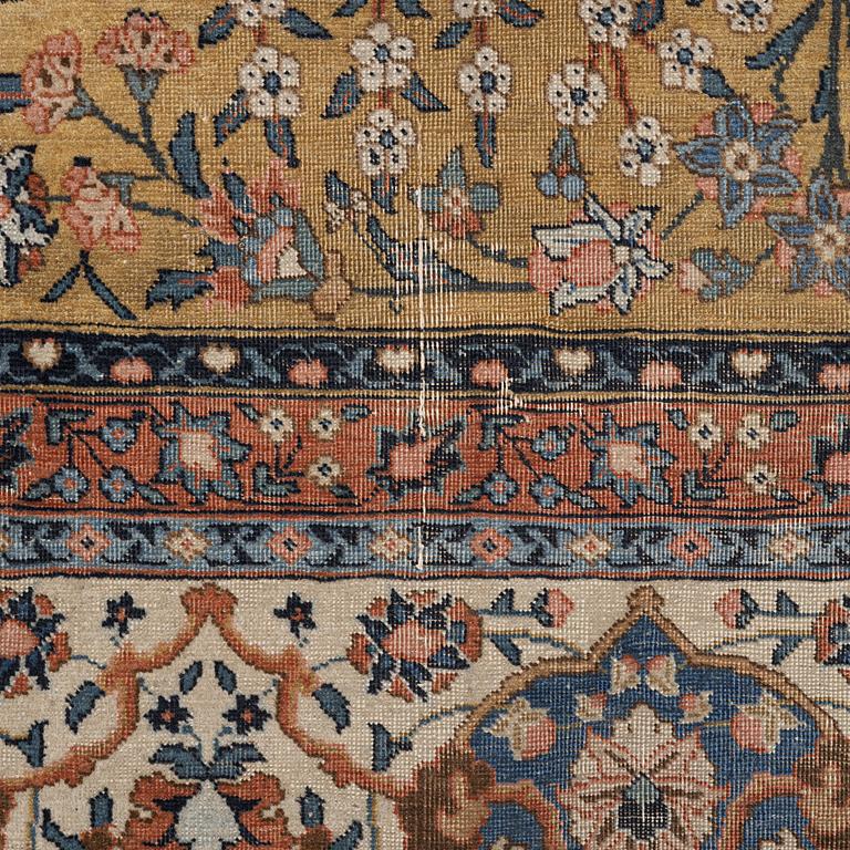 An Antique Tabriz carpet, Northwest Persia (Iran), signed Alabaf c 387 x 299 cm.
