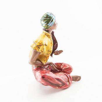 Dekorativ skulptur Sittande man med turban 1900-talets mitt/andra hälft.