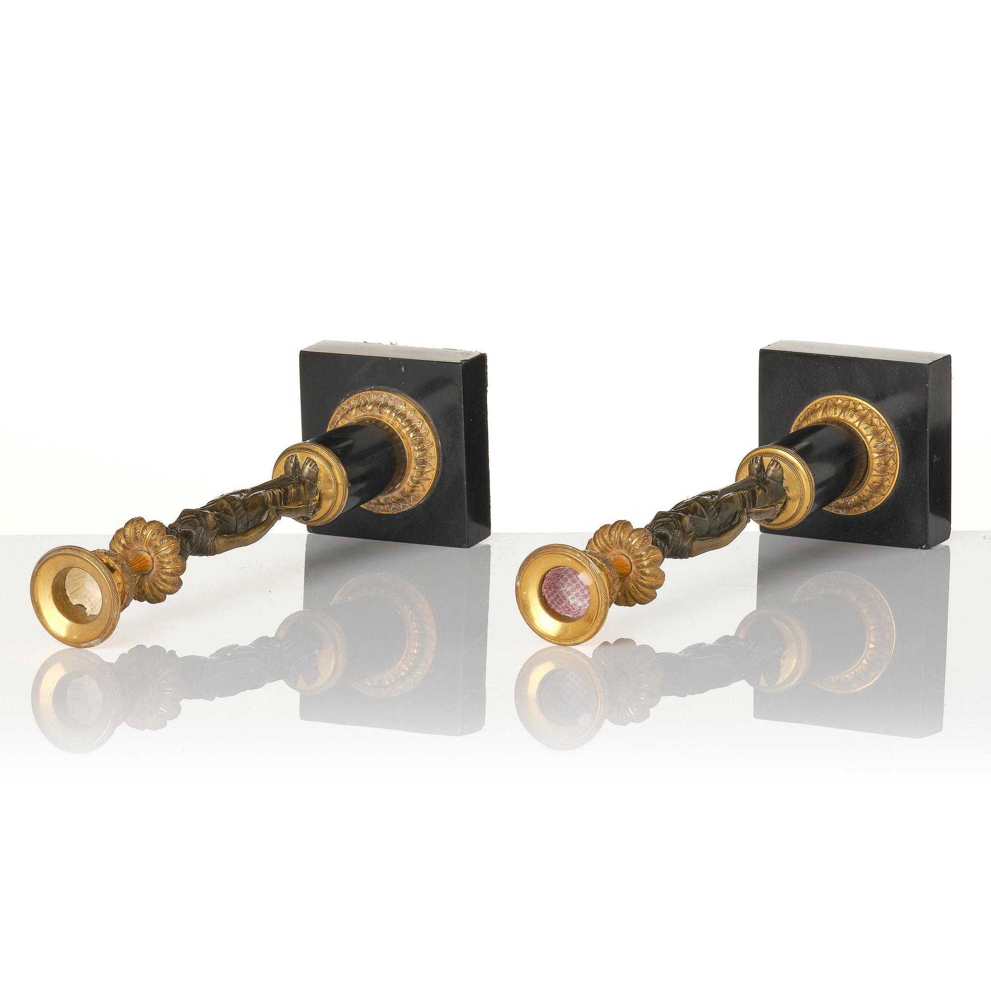 A pair of late Gustavian marble and ormolu candlesticks in the manner of F. L. Rung (1758-1837).