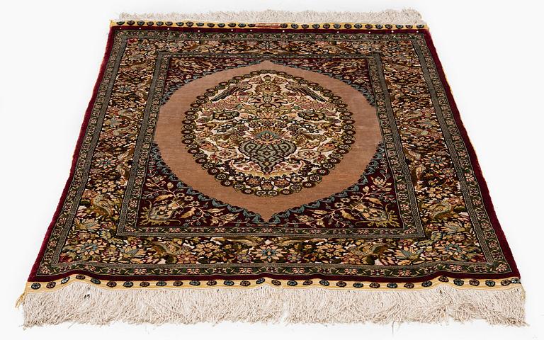 A semi-antique Hereke souf, silk and metal thread rug, West Anatolia, c. 121 x 75 cm.