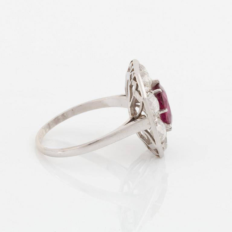 An 18K white gold ring set with a ruby and old-cut diamonds.