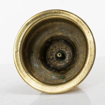 A Northern European baroque brass candlestick, late 17th century.