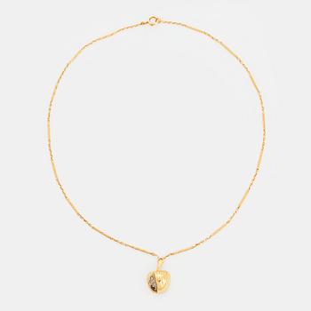 402. An 18K gold necklace in the form of an apple set with old-cut diamonds.