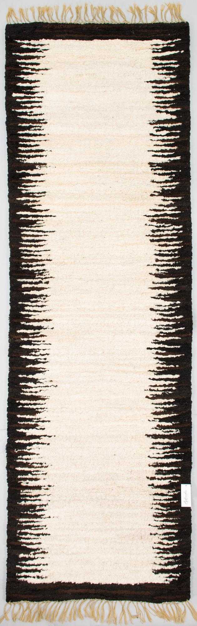 A sheepskin carper for Furcarpet. Circa 300x95 cm.
