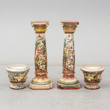 A pair of second half of the 20th century cream ware pedestals with flower pots, Capo di Monte, Italy.