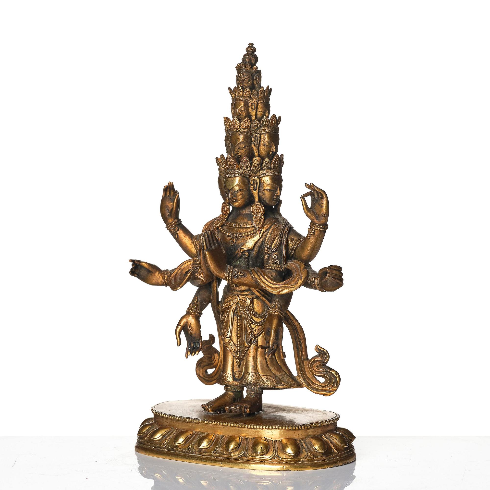 A Tibeto-Chinese gilt bronze figure of Avalokiteshvara Ekasdashamukra, 19th century.