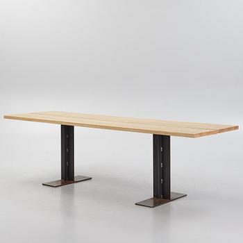 An ash and iron dining table by Sävar snicker.