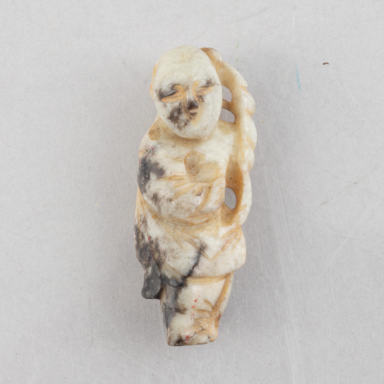 A group of four Chinese stone charms, 20th century.