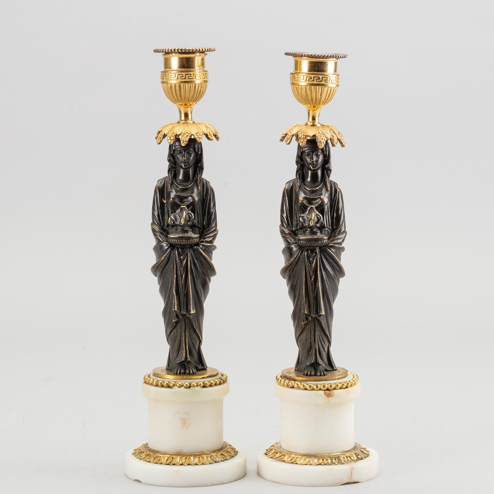 A pair of Louis XVI 18/19 century candlesticks.