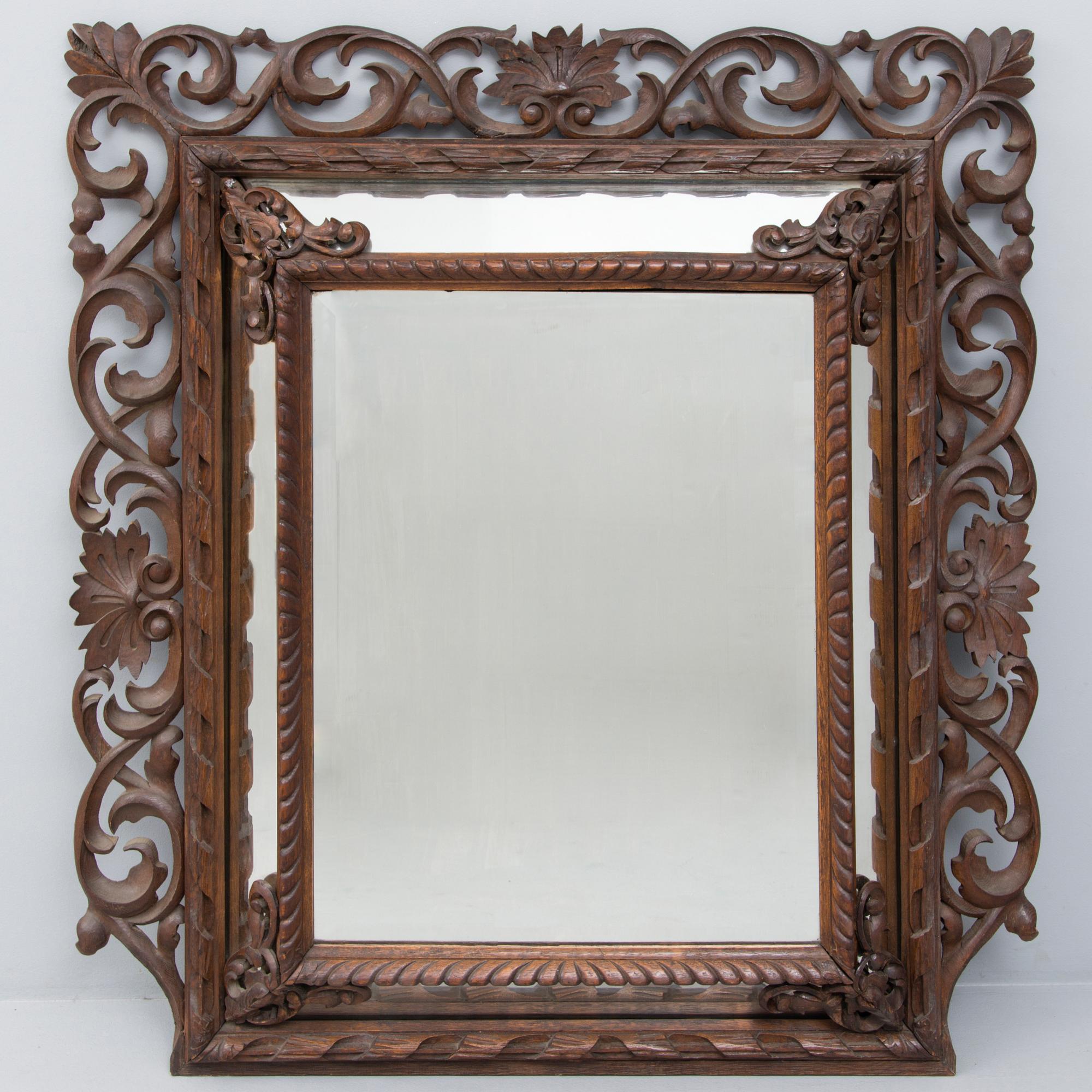 A BAROQUE MIRROR, late 19th century.