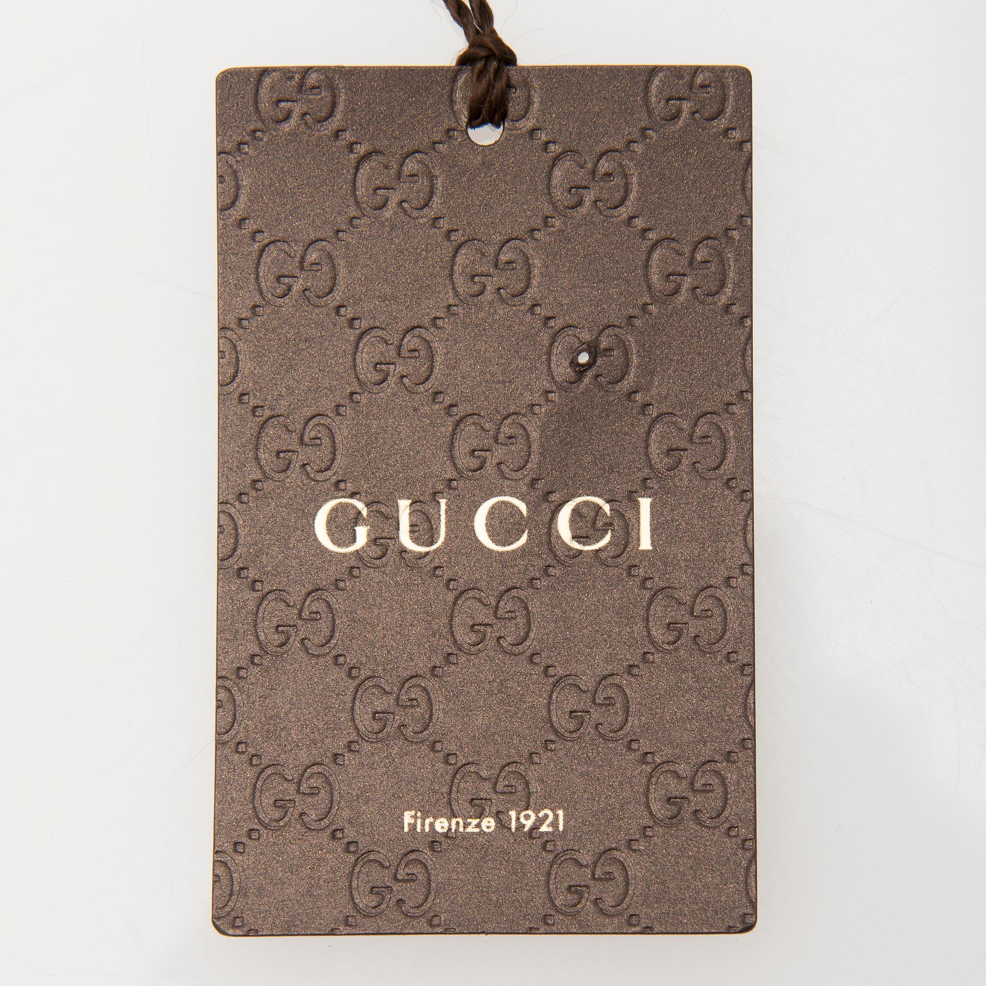 A pair of Gucci ladies' leather gloves.