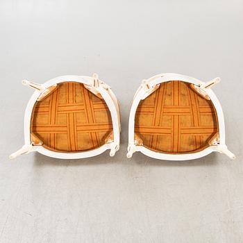 A pair of Swedish painted late Gustavian armchairs around 1800.