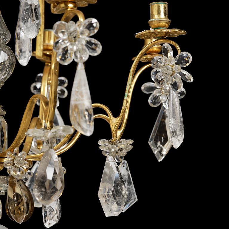 A near pair of Franch Louis-XV-style nine-branch gilt bronze and rock crystal chandeliers, later part 19th century.