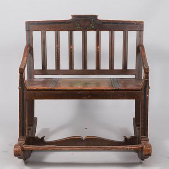 A 19th century wooden rocking chair.