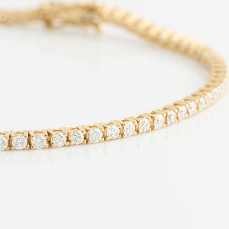 Tennisarmband, 14K guld med briljantslipade diamanter.