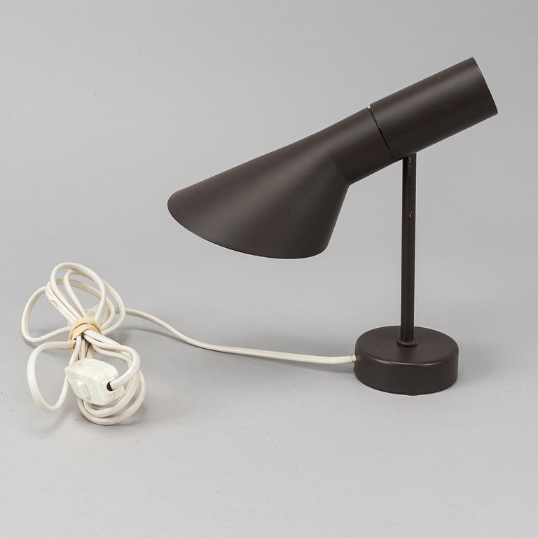 Arne Jacobsen, a black lacquered 1950/60's wall light by Axel Annell on license from Louis Poulsen.