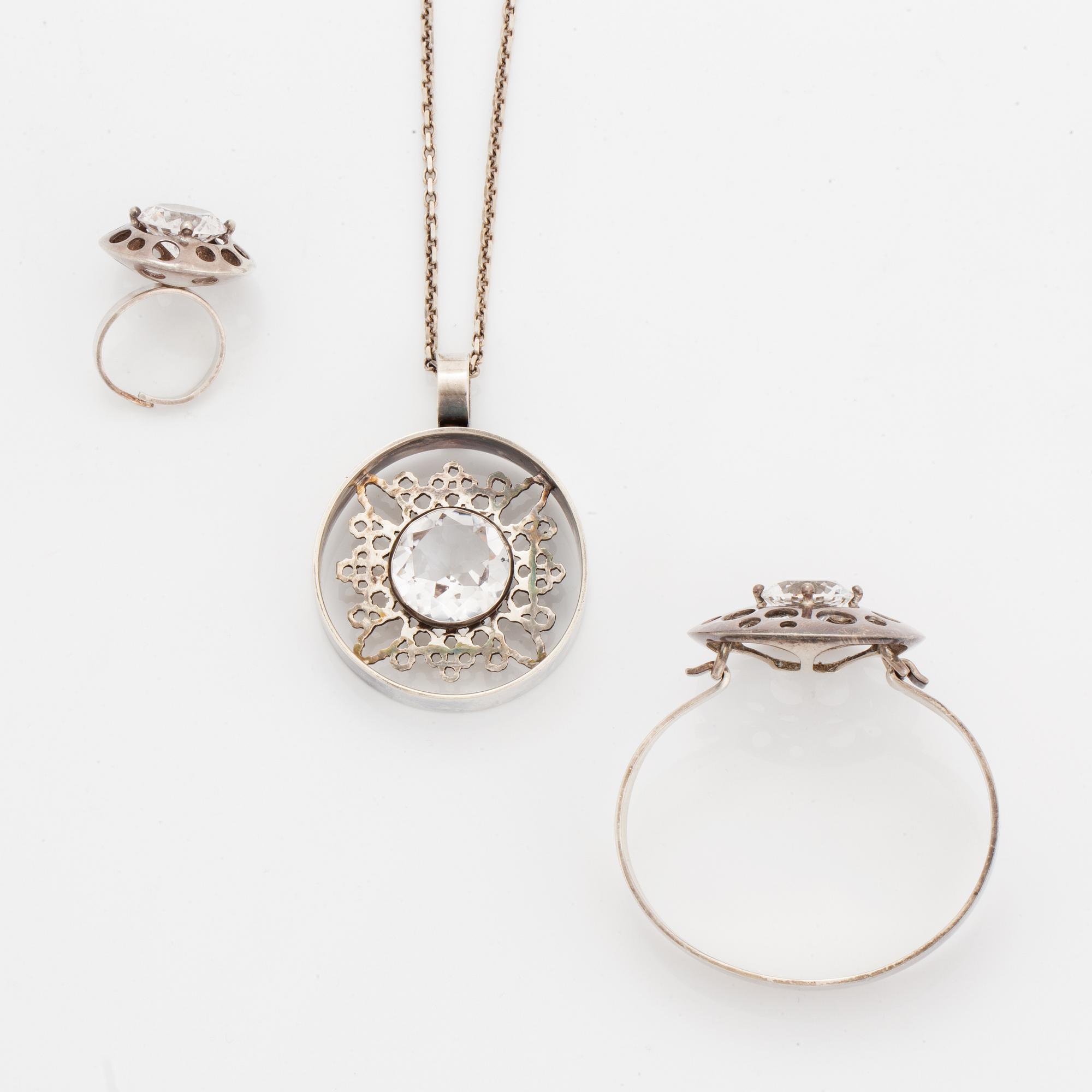 Bangle, ring and necklace, silver with colourless stones.