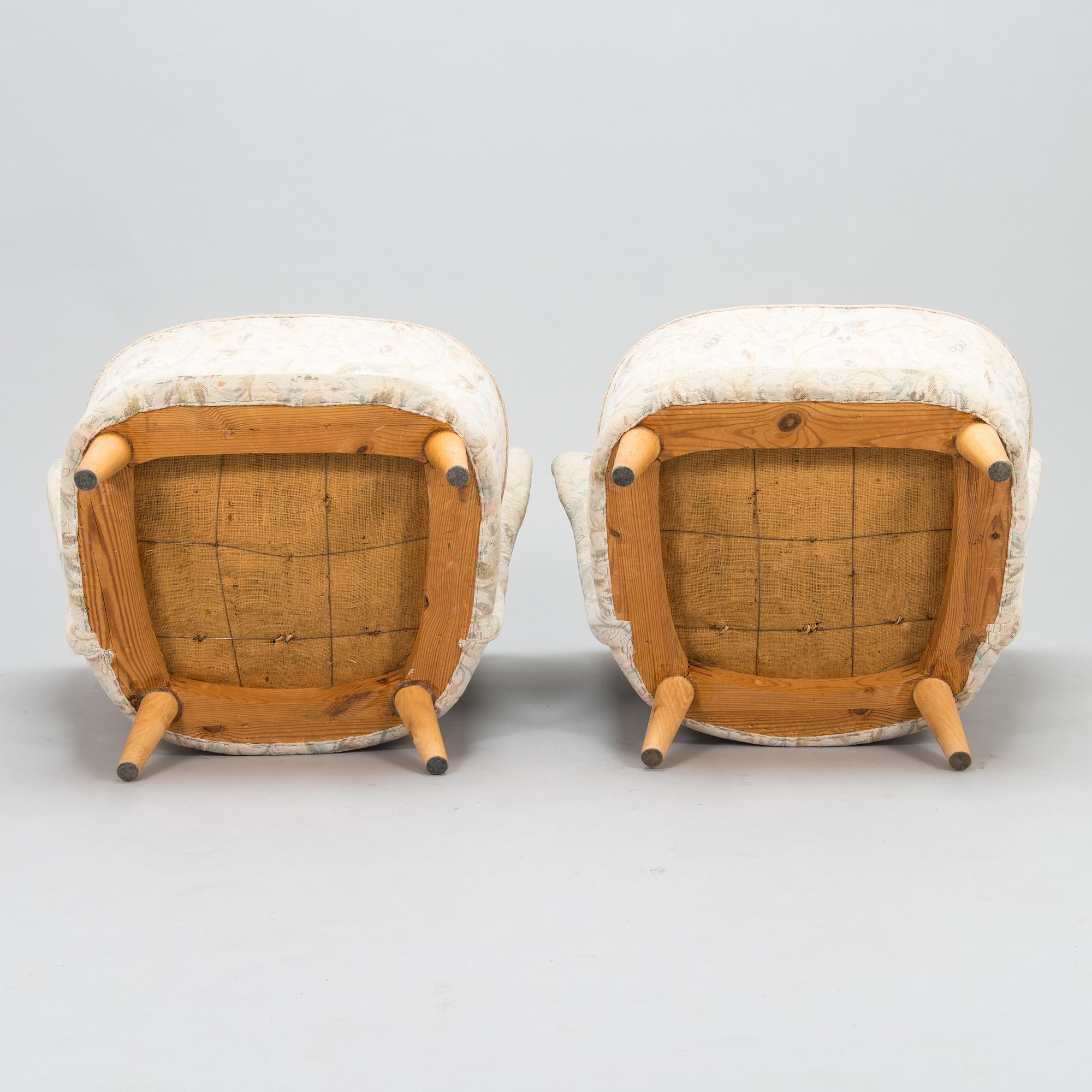 A pair of mid 20th century armchairs.