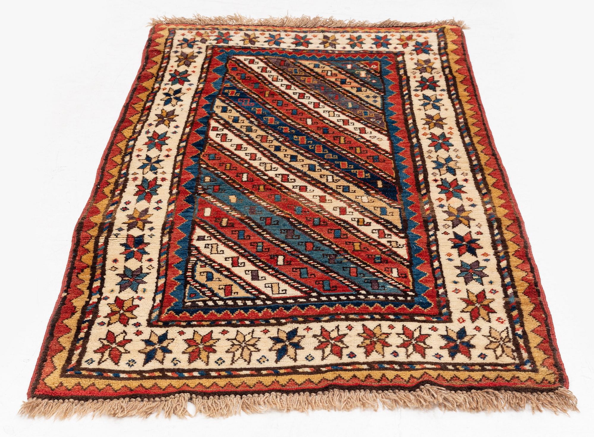 An antique Gendje rug, south Caucasus, c. 208 x 103 cm.