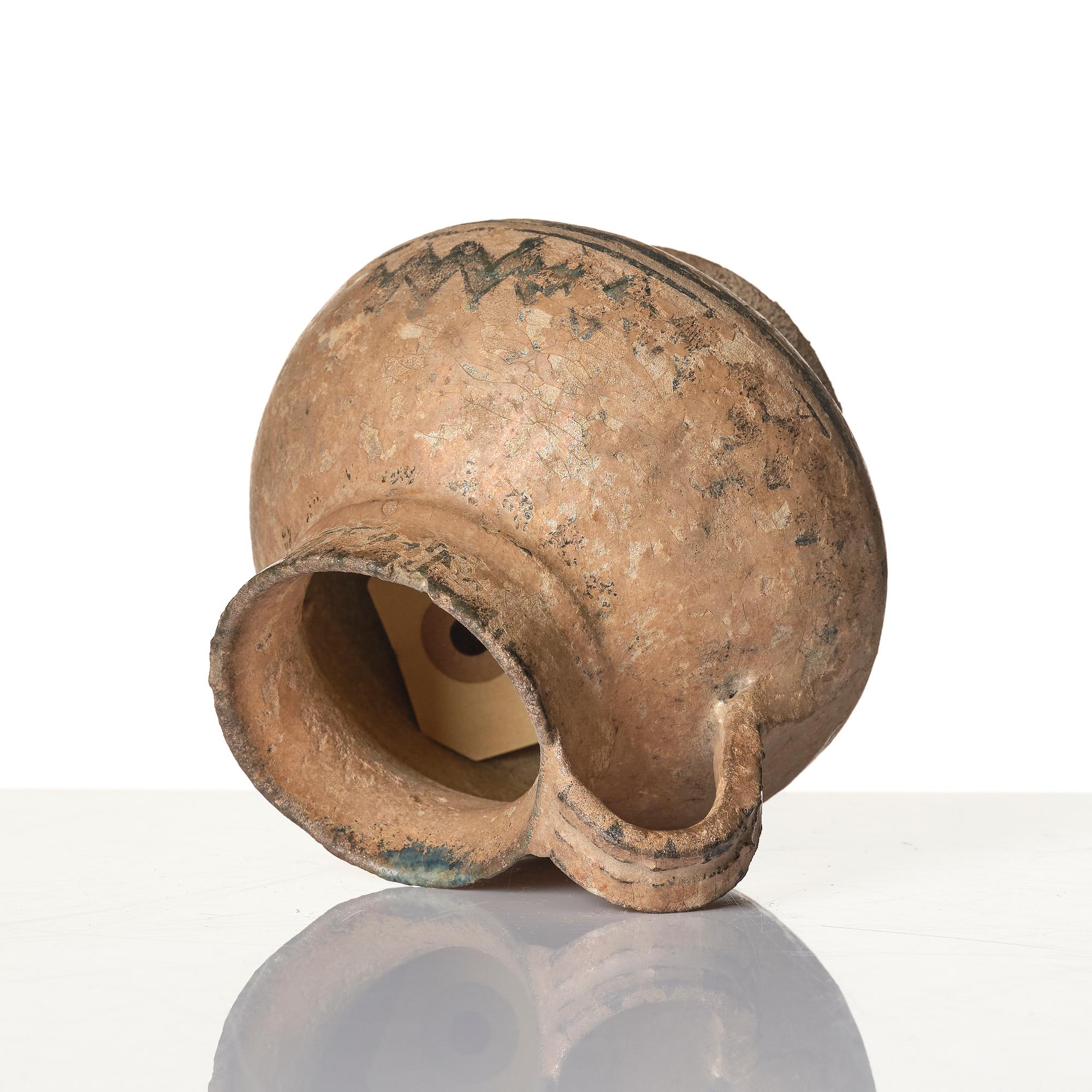 A central Asian pottery jug 12th-13th century.