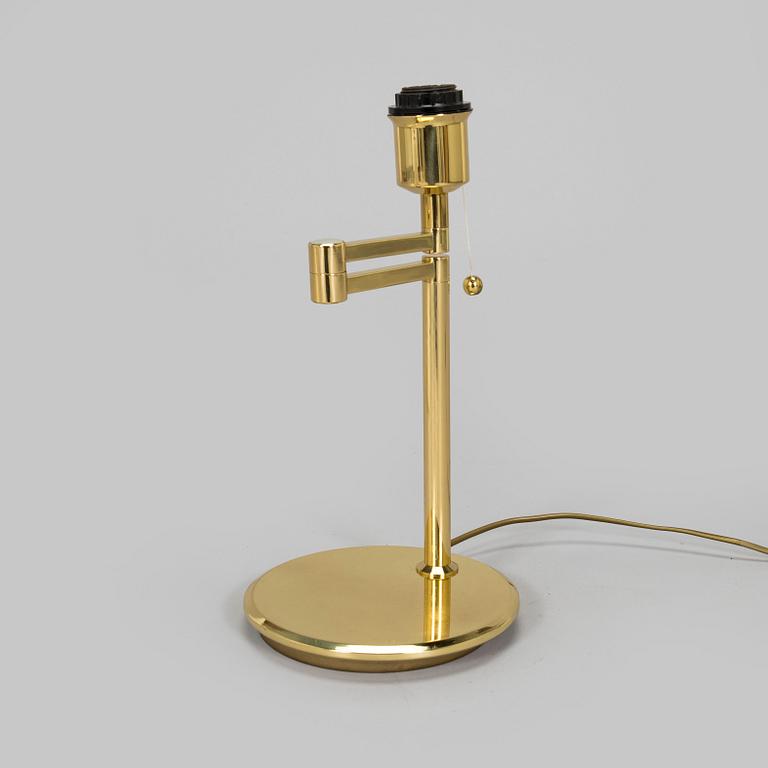 A 1970s/80s brass floor lamp, wall lamp and table lamp.