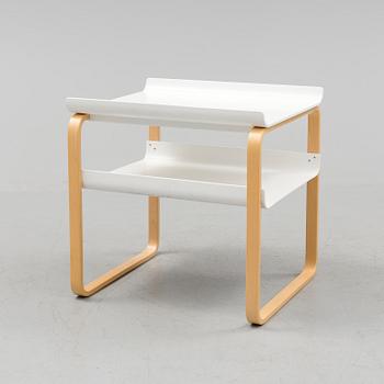An occational table model 915 by Alvar Aalto for Artek.