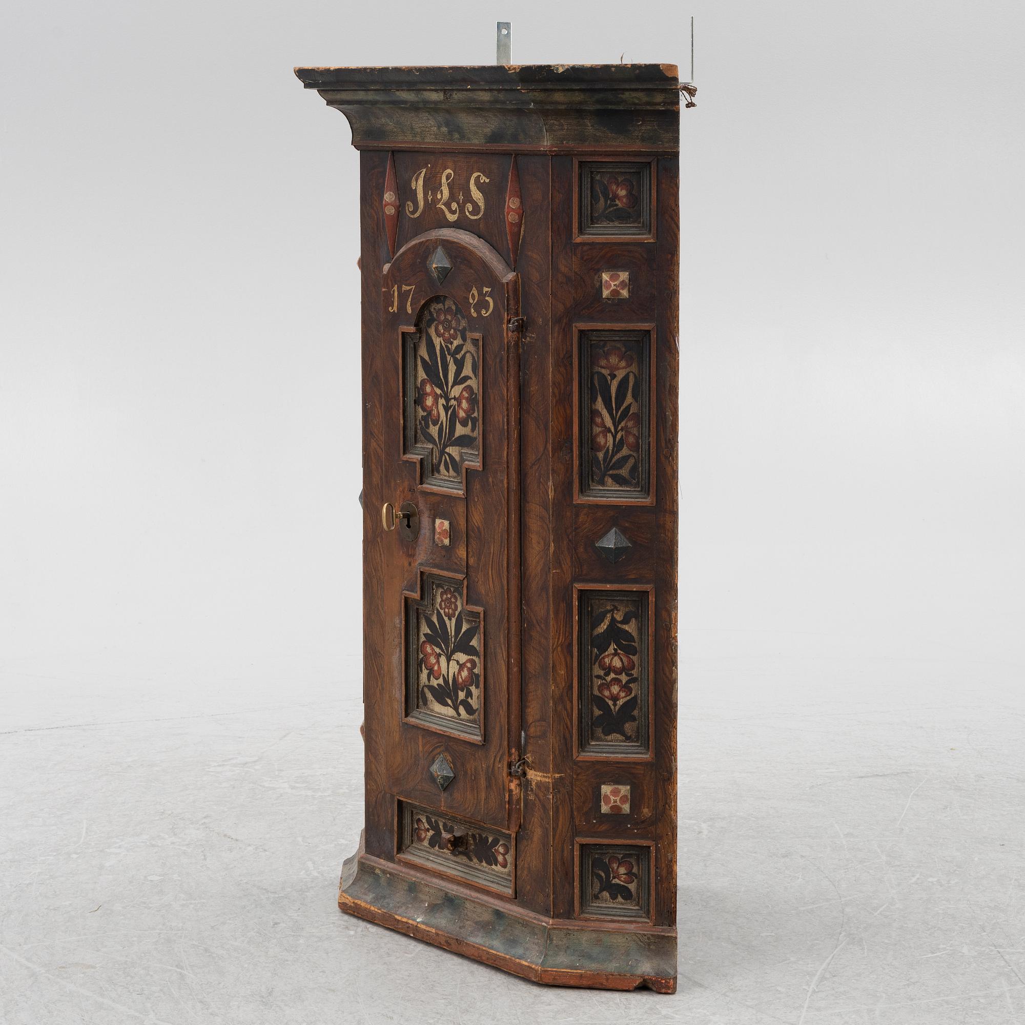 A Swedish painted corner cupboard, 18th Century.