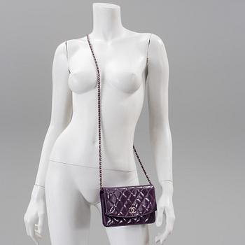 A purple lacquer handbag by Chanel  2011.