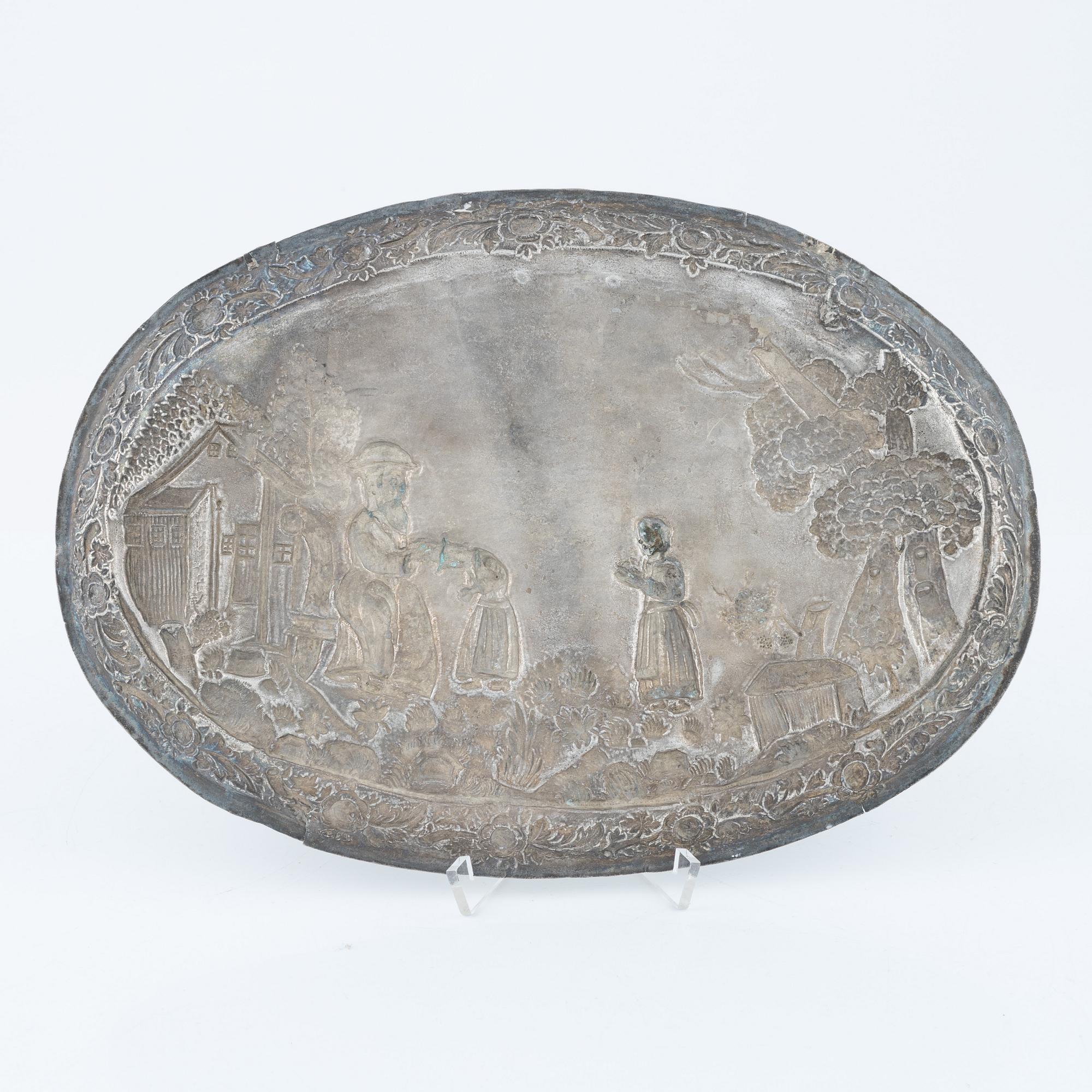 A baroque-style silver dish, 19th century.